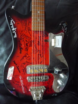 The $100 Guitar, Signed by the Musicians